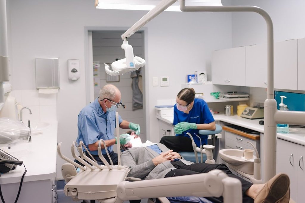 Patient receiving dental crown treatment at Mary St Dental Gympie, close-up view of dental procedure and caring team.