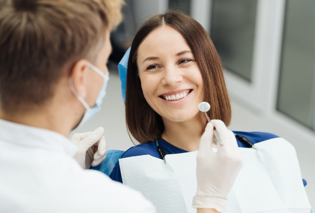 Smiling woman with healthy teeth representing the connection between dental health and overall health. Maintaining good oral hygiene and regular dental checkups helps support long-term health for patients in Gympie.