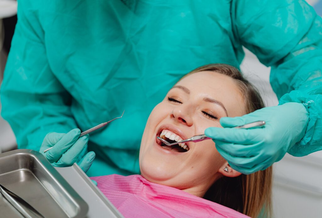 Dental professional performing full mouth restoration procedure at Mary St Dental Gympie