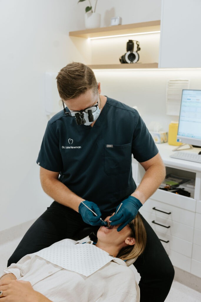 Dentist performing cosmetic dental treatment at Mary St Dental Gympie