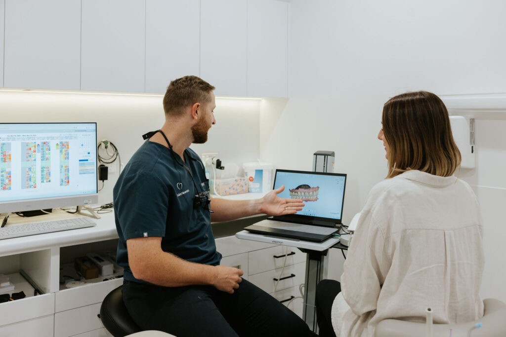 Dentist using a digital intraoral scanner during a dental examination at Mary Street Dental in Gympie