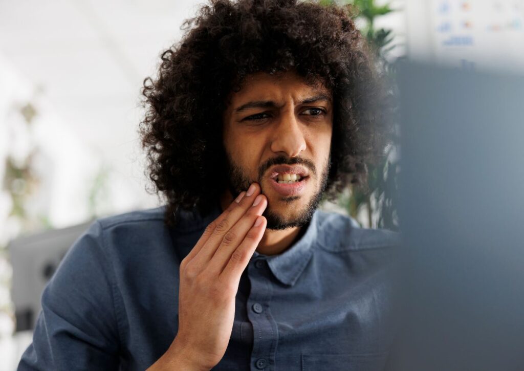 Patient experiencing severe toothache needing emergency dental treatment in Gympie